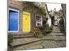 Yellow and Blue Doors on Houses in the Opening, Robin Hood's Bay, England-Pearl Bucknall-Mounted Photographic Print