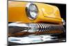 Yellow Car Grill & Headlight-null-Mounted Art Print