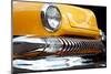 Yellow Car Grill & Headlight-null-Mounted Art Print