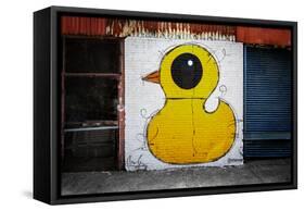 Yellow Duck on Brick Wall in Brooklyn NY-null-Framed Stretched Canvas