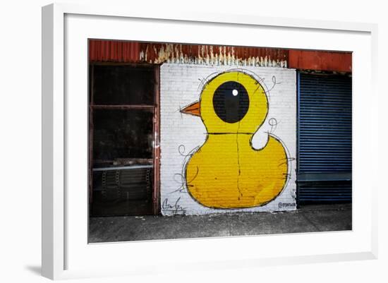 Yellow Duck on Brick Wall in Brooklyn NY-null-Framed Photo