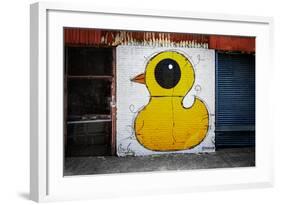 Yellow Duck on Brick Wall in Brooklyn NY-null-Framed Photo