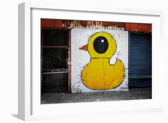 Yellow Duck on Brick Wall in Brooklyn NY-null-Framed Photo