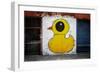 Yellow Duck on Brick Wall in Brooklyn NY-null-Framed Photo