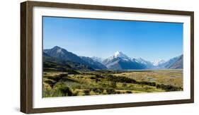 Yellow grass field with large mountains in the distance, South Island, New Zealand, Pacific-Logan Brown-Framed Photographic Print