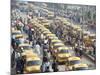 Yellow Kolkata Taxis and Commuters at Howrah Railway Station, Howrah, Kolkata (Calcutta), India-Annie Owen-Mounted Photographic Print