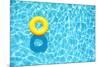 Yellow Pool Float, Ring Floating in a Refreshing Blue Swimming Pool-StacieStauffSmith Photos-Mounted Photographic Print