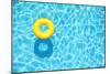 Yellow Pool Float, Ring Floating in a Refreshing Blue Swimming Pool-StacieStauffSmith Photos-Mounted Photographic Print
