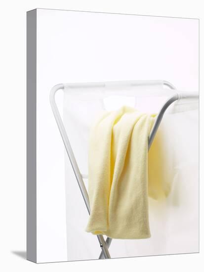 Yellow T-Shirt on Laundry Hamper-null-Stretched Canvas