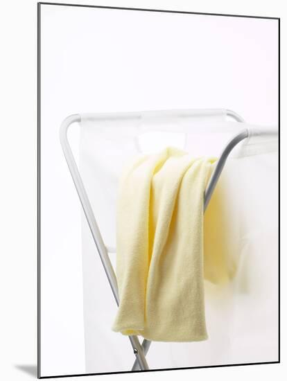 Yellow T-Shirt on Laundry Hamper-null-Mounted Photographic Print
