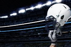 Raised Football Helmet at an American Football Stadium-yobro-Framed Photographic Print