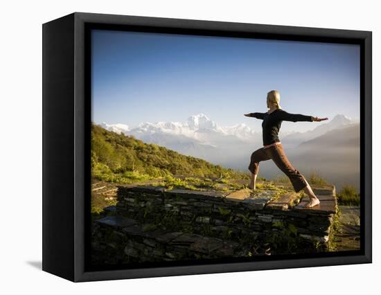 Yoga  in the Morning Sun Upon Poon Hill Along the  Anapurna Circuit - Ghorepani, Nepal-Dan Holz-Framed Stretched Canvas