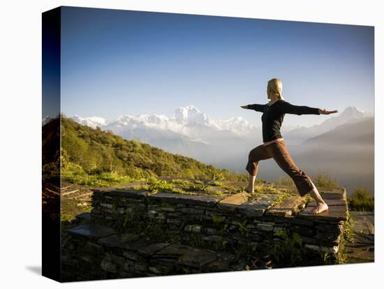 Yoga  in the Morning Sun Upon Poon Hill Along the  Anapurna Circuit - Ghorepani, Nepal-Dan Holz-Stretched Canvas