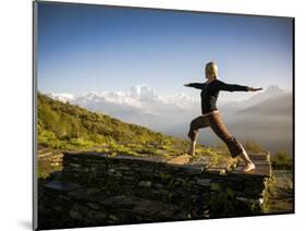 Yoga  in the Morning Sun Upon Poon Hill Along the  Anapurna Circuit - Ghorepani, Nepal-Dan Holz-Mounted Photographic Print
