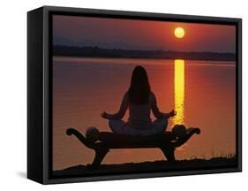 Yoga on a Saddle Bench Watching the Sun Go Down across the Zambesi River, Zambia-John Warburton-lee-Framed Stretched Canvas