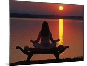 Yoga on a Saddle Bench Watching the Sun Go Down across the Zambesi River, Zambia-John Warburton-lee-Mounted Photographic Print