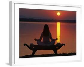 Yoga on a Saddle Bench Watching the Sun Go Down across the Zambesi River, Zambia-John Warburton-lee-Framed Photographic Print