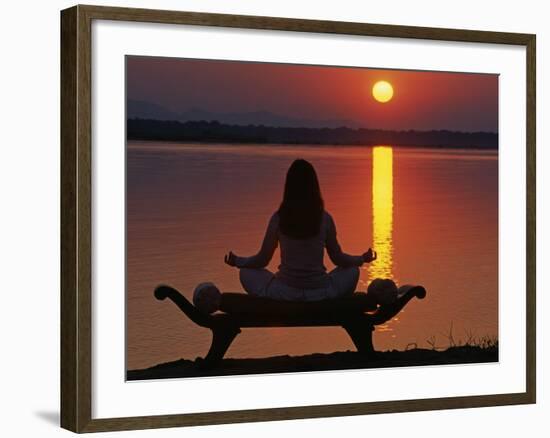 Yoga on a Saddle Bench Watching the Sun Go Down across the Zambesi River, Zambia-John Warburton-lee-Framed Photographic Print