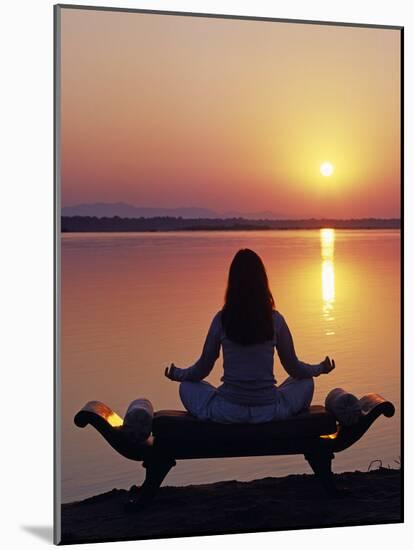 Yoga on a Saddle Bench Watching the Sun Go Down across the Zambesi River, Zambia-John Warburton-lee-Mounted Photographic Print