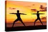 Yoga People Training and Meditating in Warrior Pose Outside by Beach at Sunrise or Sunset-Maridav-Stretched Canvas