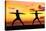 Yoga People Training and Meditating in Warrior Pose Outside by Beach at Sunrise or Sunset-Maridav-Stretched Canvas