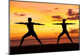 Yoga People Training and Meditating in Warrior Pose Outside by Beach at Sunrise or Sunset-Maridav-Mounted Premium Photographic Print