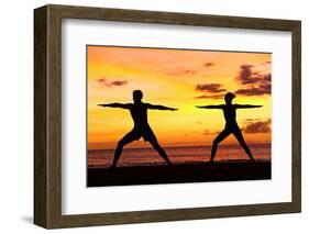 Yoga People Training and Meditating in Warrior Pose Outside by Beach at Sunrise or Sunset-Maridav-Framed Photographic Print