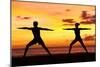 Yoga People Training and Meditating in Warrior Pose Outside by Beach at Sunrise or Sunset-Maridav-Mounted Photographic Print