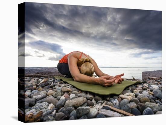 Yoga Position of Child's Pose in Lincoln Park - West Seattle, Washington-Dan Holz-Stretched Canvas