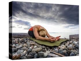 Yoga Position of Child's Pose in Lincoln Park - West Seattle, Washington-Dan Holz-Stretched Canvas