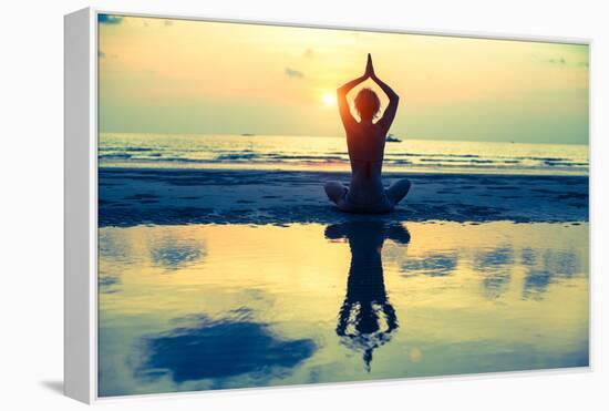 Yoga Woman Sitting In Lotus Pose On The Beach During Sunset-De Visu-Framed Stretched Canvas