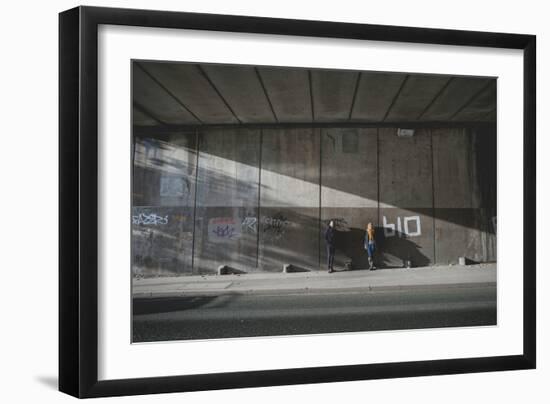 Young Adult Couple Standing in Underpass-Clive Nolan-Framed Photographic Print