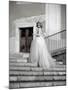 Young Adult Female in Long Wedding Dress Standing on Steps-Steven Boone-Mounted Photographic Print