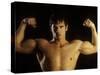 Young Adult Male Posing with Arms Flexed-Chris Trotman-Stretched Canvas