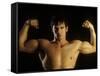 Young Adult Male Posing with Arms Flexed-Chris Trotman-Framed Stretched Canvas