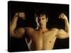 Young Adult Male Posing with Arms Flexed-Chris Trotman-Stretched Canvas