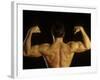 Young Adult Male Posing with Arms Flexed-Chris Trotman-Framed Photographic Print