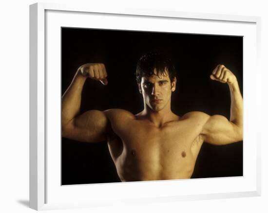 Young Adult Male Posing with Arms Flexed-Chris Trotman-Framed Photographic Print