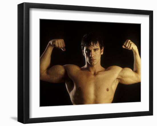 Young Adult Male Posing with Arms Flexed-Chris Trotman-Framed Photographic Print