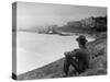 Young African American Boy Sitting on Memphis Riverbank Watching Boats on the Mississippi River-Ed Clark-Stretched Canvas