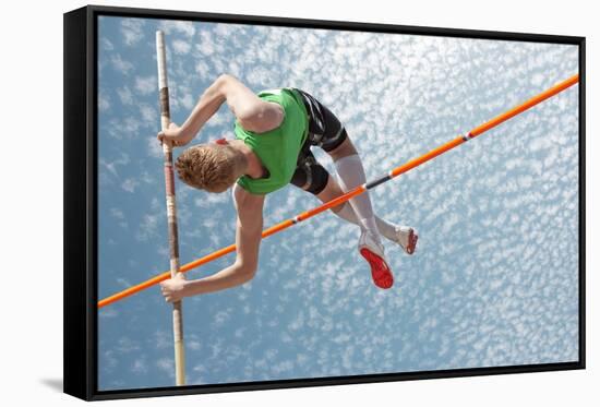 Young Athletes Pole Vault Seems to Reach the Sky-mezzotint-Framed Stretched Canvas