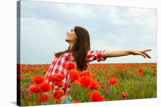 Young Beautiful Woman Walking and Dancing through a Poppy Field, Summer Outdoor.-khorzhevska-Stretched Canvas