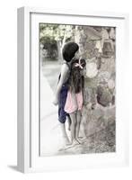 Young Boy and Girl Peeking around a Stone Wall.-Nora Hernandez-Framed Giclee Print