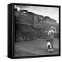 Young Boy and His Dog Standing at the Crossing as a Train Rides Through-Myron Davis-Framed Stretched Canvas