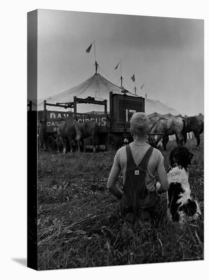 Young Boy and His Dog Watching the Circus Tents Being Set Up-Myron Davis-Stretched Canvas