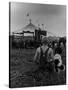 Young Boy and His Dog Watching the Circus Tents Being Set Up-Myron Davis-Stretched Canvas