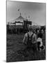 Young Boy and His Dog Watching the Circus Tents Being Set Up-Myron Davis-Mounted Photographic Print