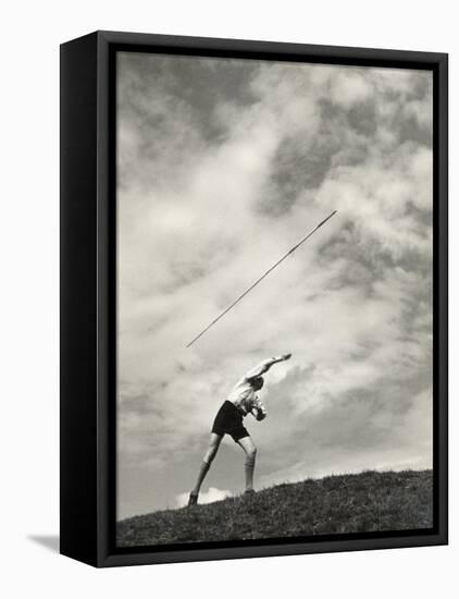 Young Boy Atop a Hill Hurls a Javelin into the Air-null-Framed Stretched Canvas