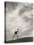 Young Boy Atop a Hill Hurls a Javelin into the Air-null-Stretched Canvas