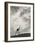Young Boy Atop a Hill Hurls a Javelin into the Air-null-Framed Photographic Print